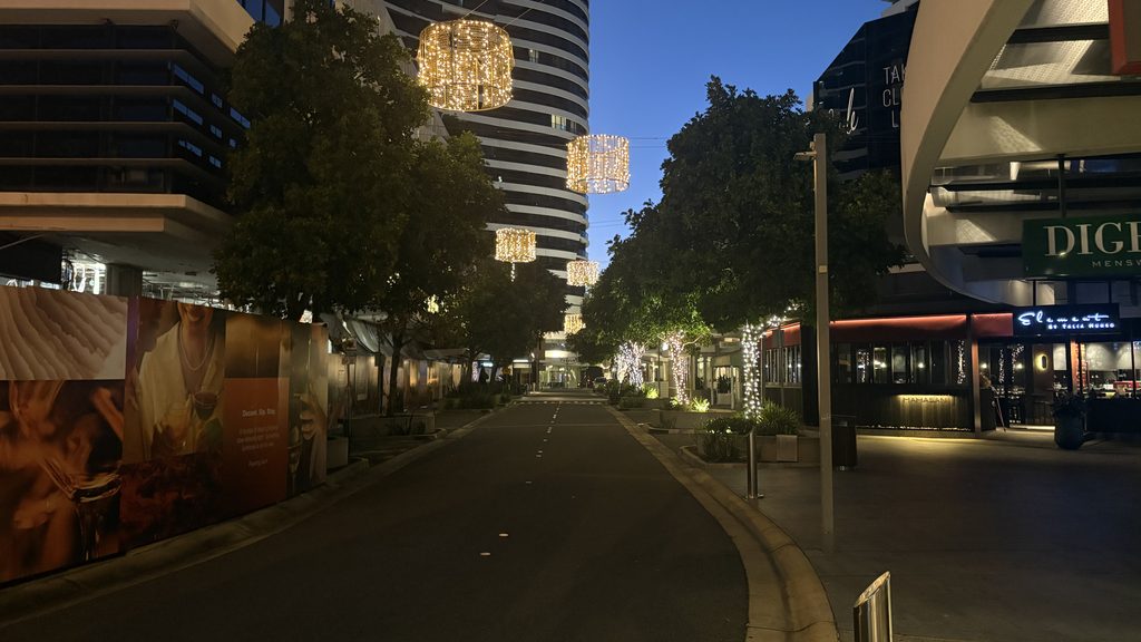 Oracle Boulevard Broadbeach at dusk with the restaurant strip and hanging lights lit up